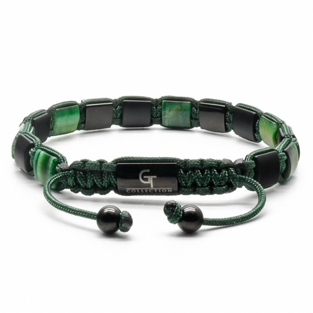 Green tiger eye beaded bracelet with macrame cord and black spacers, flat lay