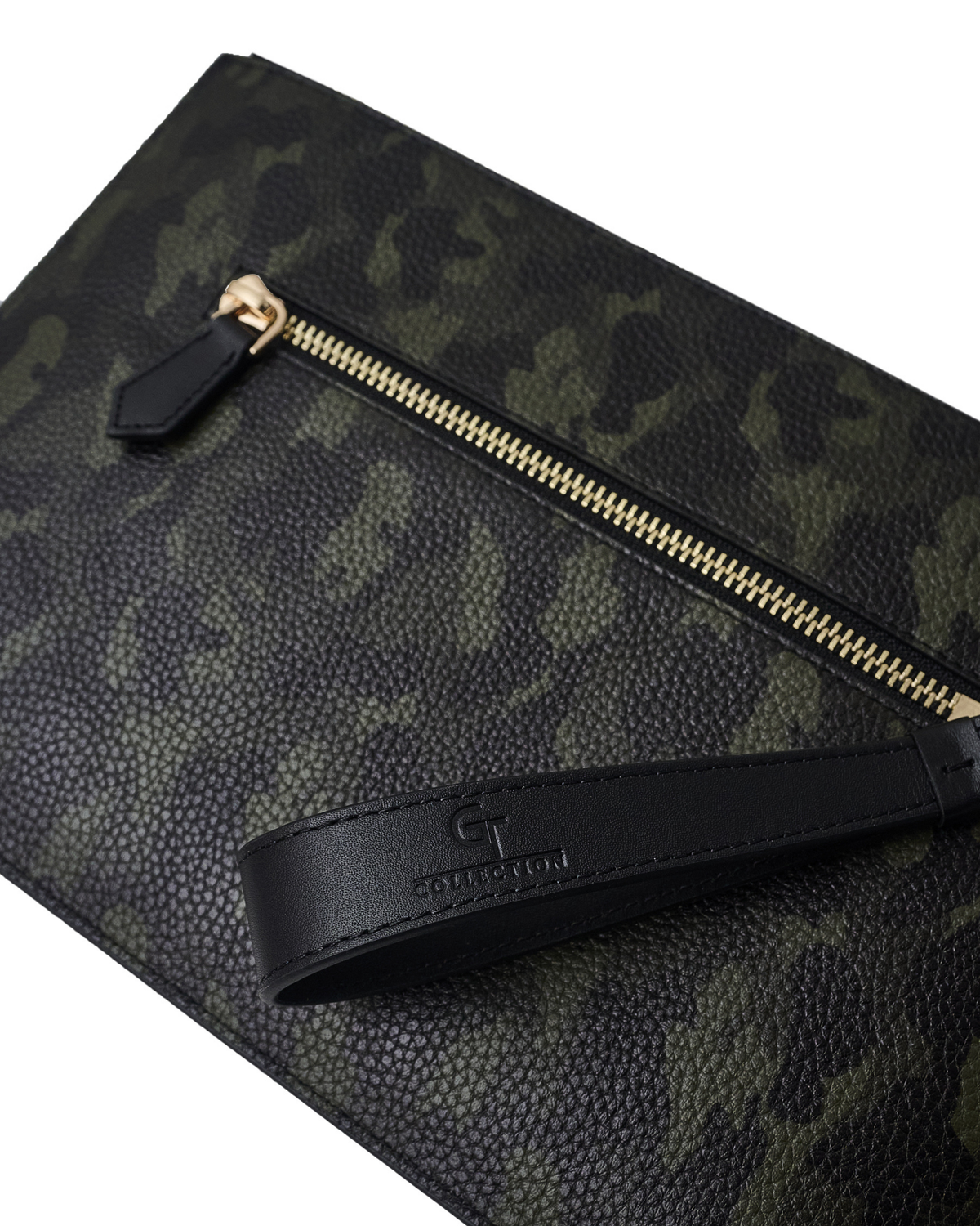 Camouflage leather pouch close-up with gold zipper track and black logo patch