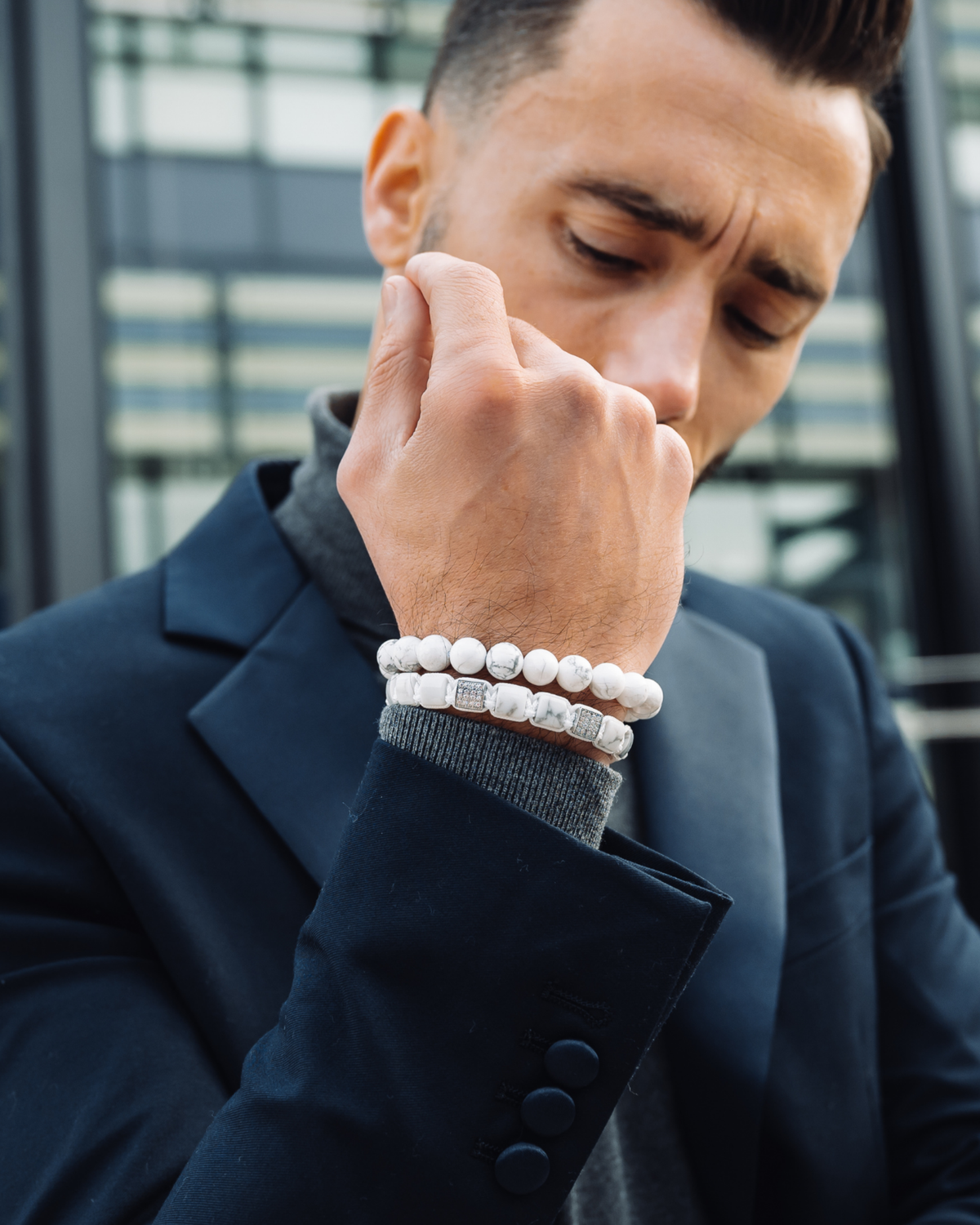 White howlite bead bracelets on wrist with silver-tone accent beads