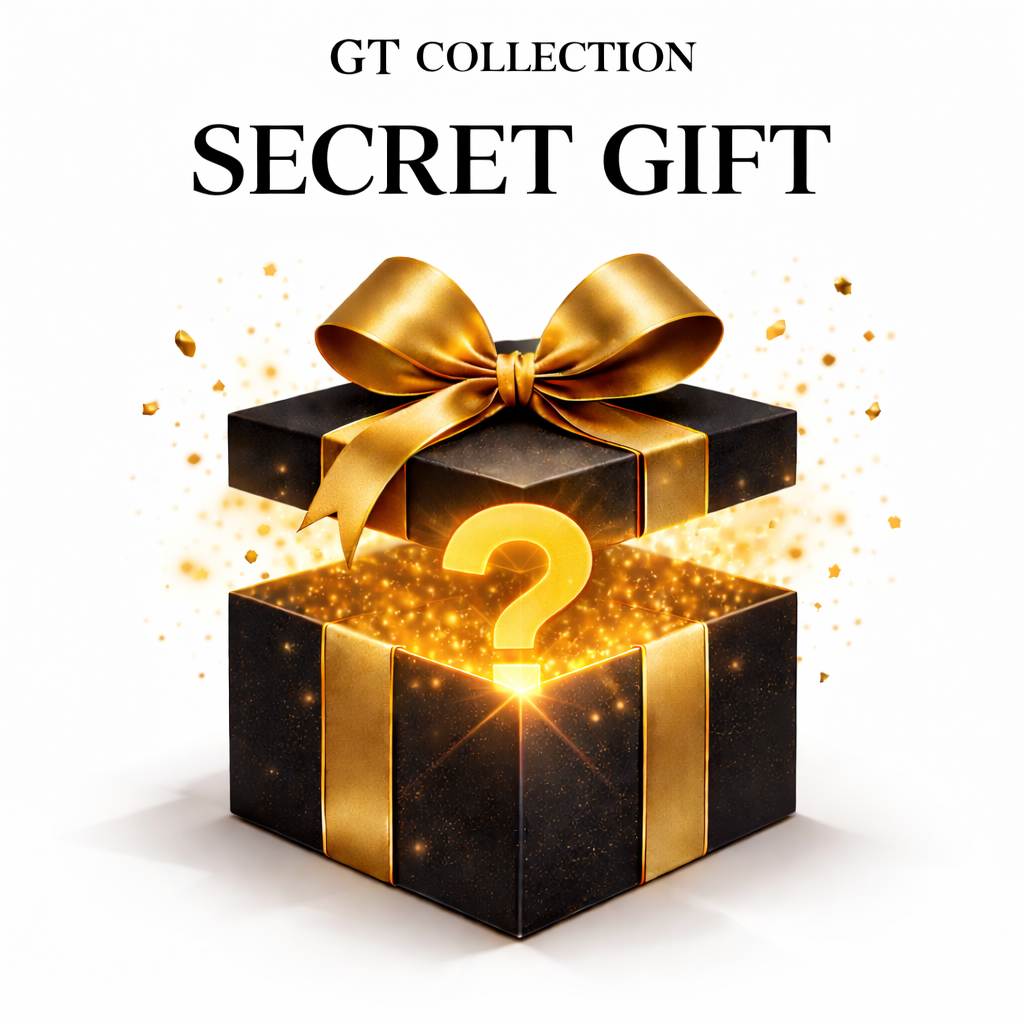 Black gift box with gold ribbon and question-mark emblem