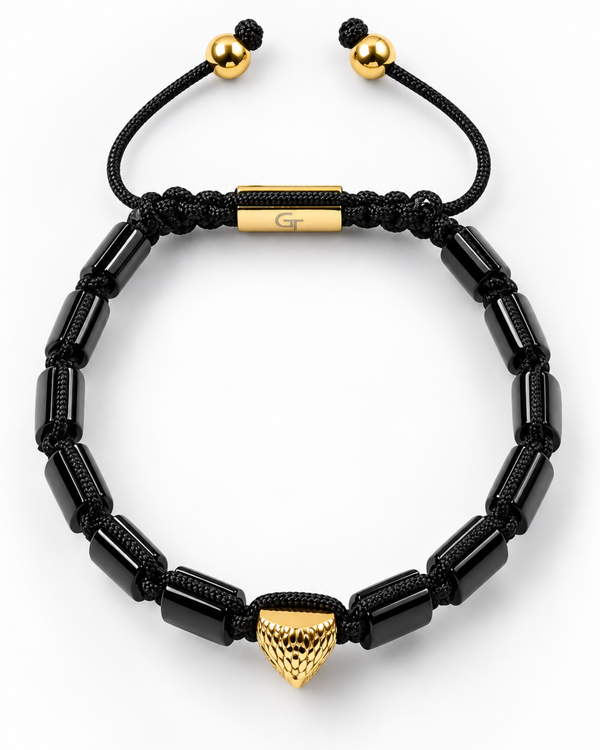 Black beaded bracelet with gold eagle drop charm and glossy black link segments