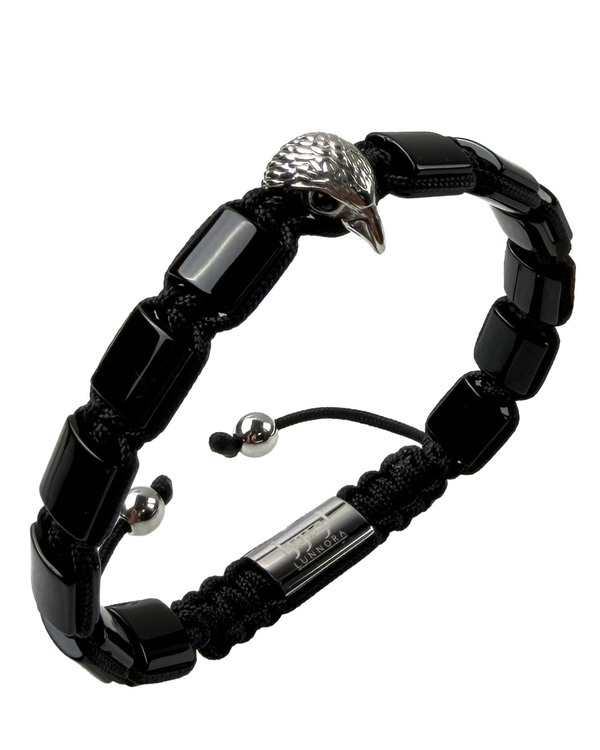 Black bracelet with silver-toned eagle head connector and adjustable cord