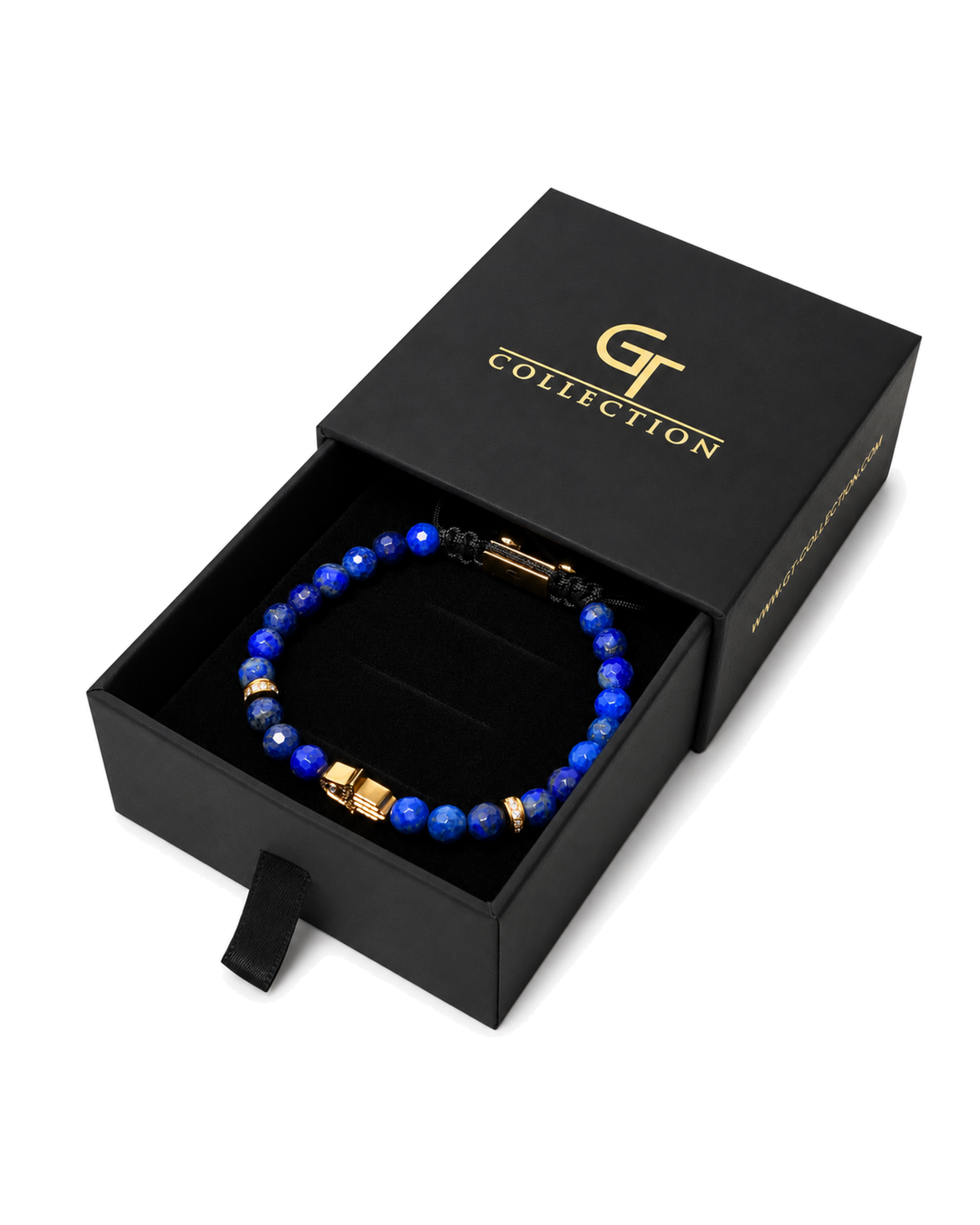 Blue lapis bead bracelet in black gift box with gold accents on black cord.