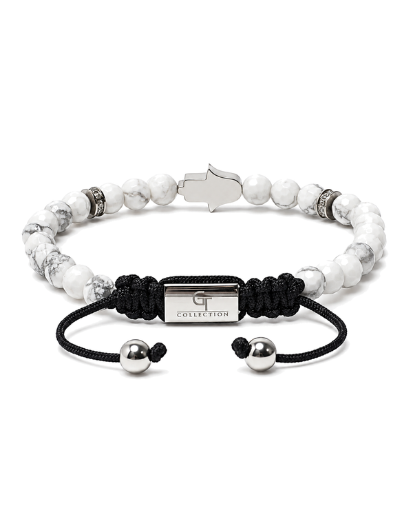 White howlite bead bracelet with black cord and G Collection label center