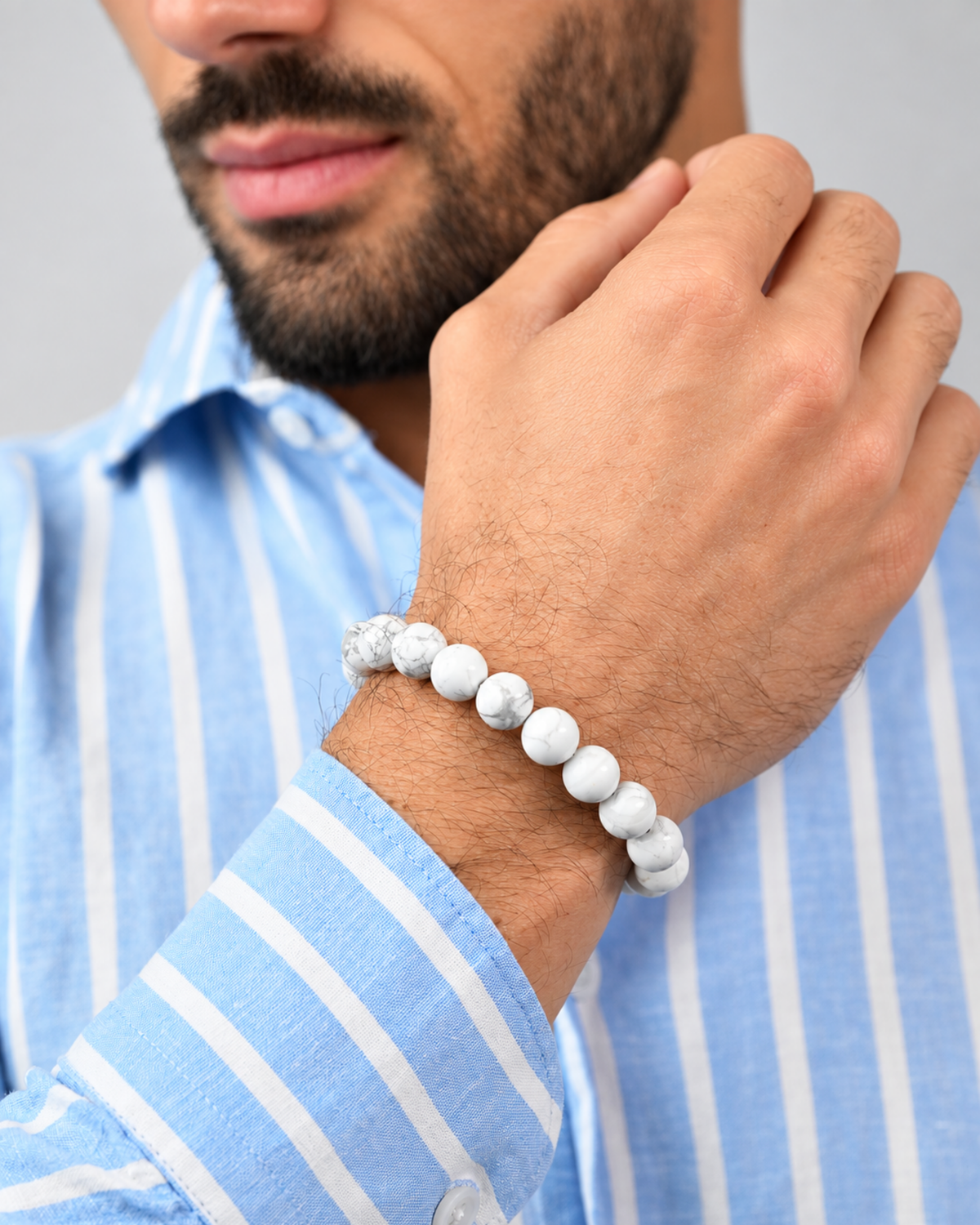 White howlite bead bracelet on forearm with silver-tone accent beads