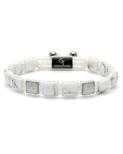 White marble-effect bead bracelet with black logo centerpiece and silver end beads