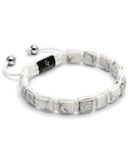 White marble-effect bead bracelet with black logo centerpiece and silver end beads