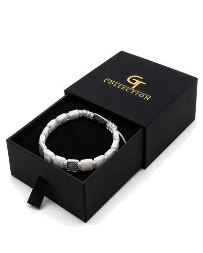 White marble-effect bead bracelet shown in a black gift box