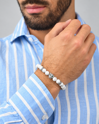 White howlite bead bracelet worn on wrist with silver bead details