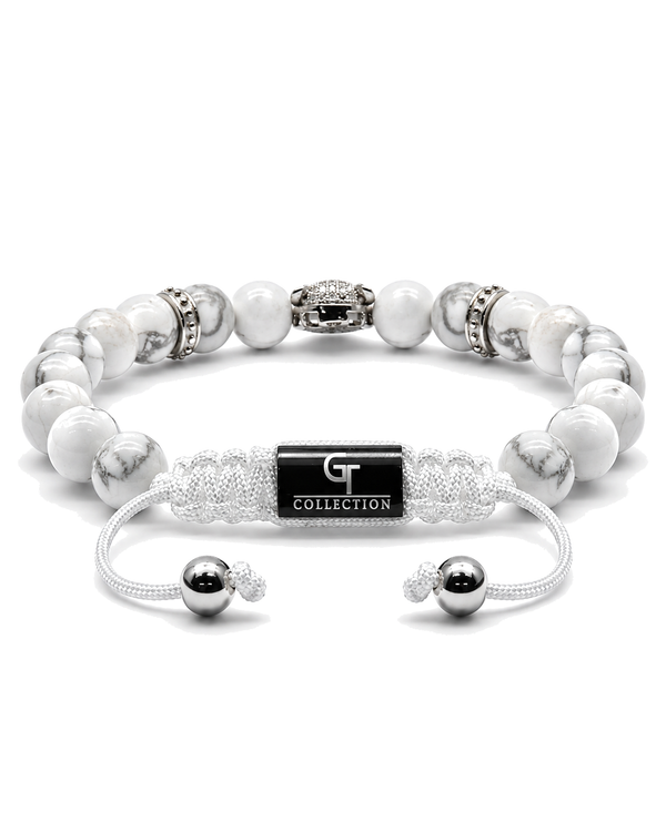 White howlite bead bracelet with silver leopard-style centerpiece and charm accents