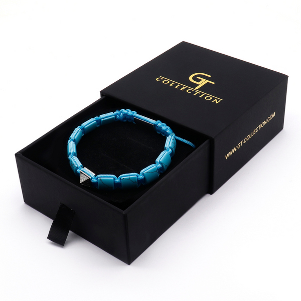 Turquoise flat bead bracelet in a black gift box with silver-tone clasp