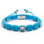 Turquoise flat bead bracelet with braided cord, silver-tone center plate and end beads