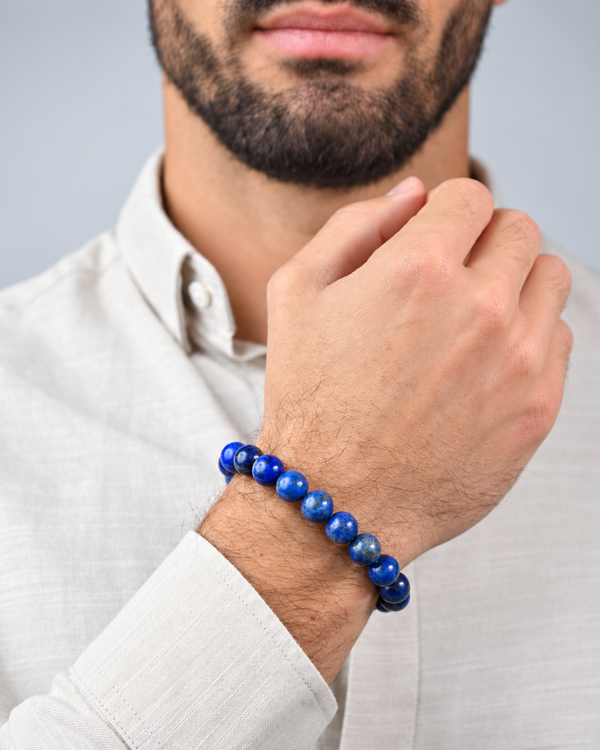 Lapis lazuli beaded bracelet worn on wrist with white button-up shirt