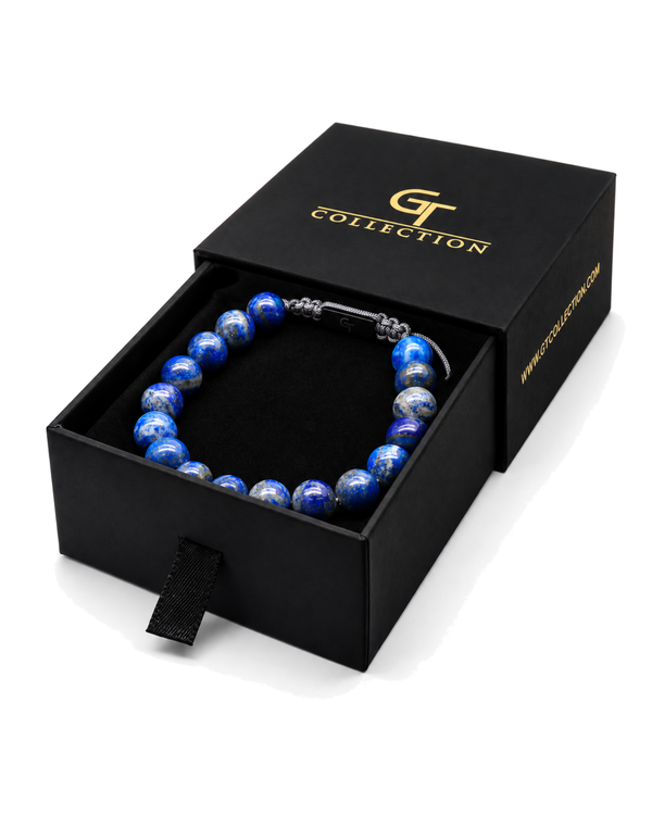 Blue lapis lazuli bead bracelet displayed in a black gift box