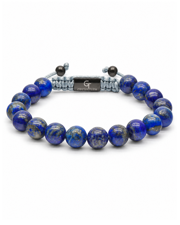 Blue lapis lazuli bead bracelet with gray cord and engraved center plate detail
