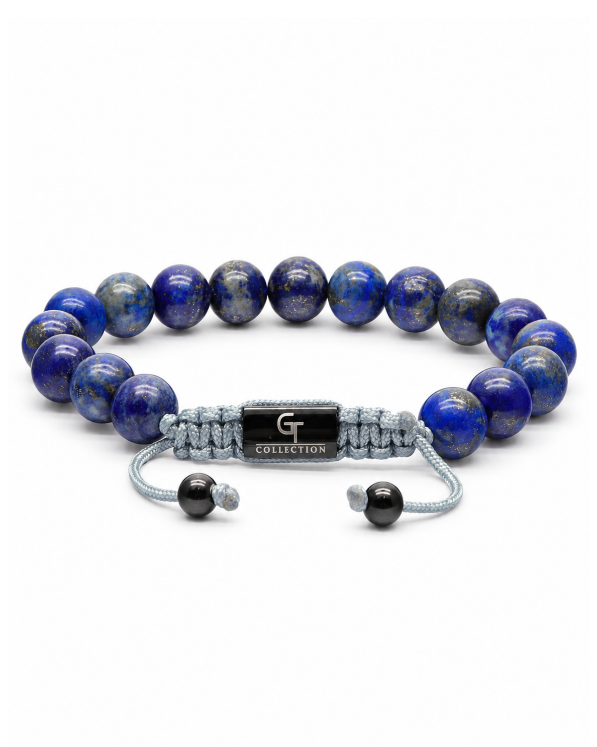 Blue lapis lazuli bead bracelet with gray cord and engraved metal centerpiece