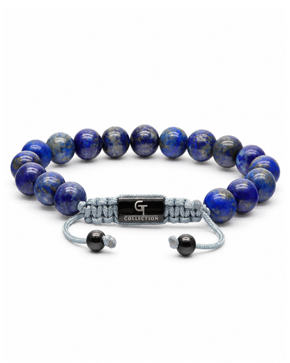 Blue lapis lazuli bead bracelet with gray cord and engraved metal centerpiece