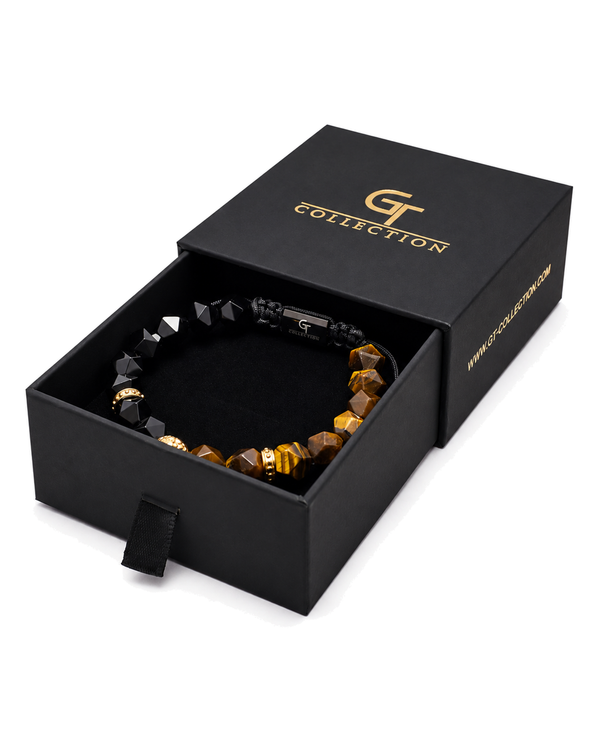 Lion beaded bracelet inside black gift box with gold tiger-eye and black beads