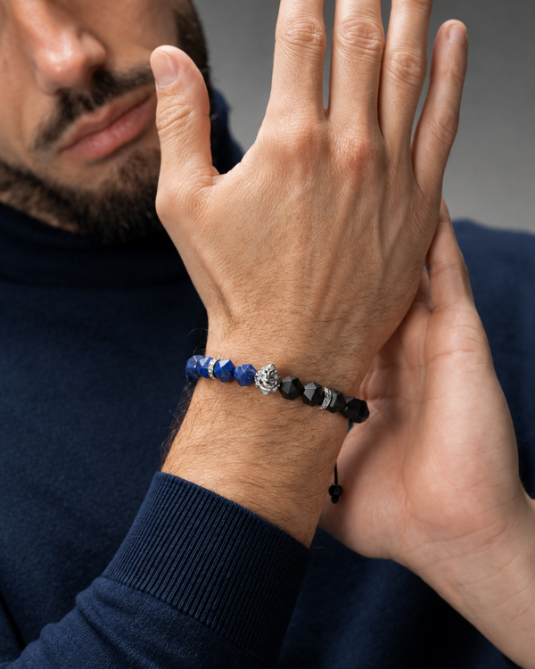 Man wearing lapis lazuli and black onyx beaded lion bracelet on wrist