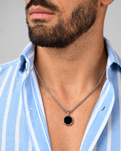 Men's silver-tone pendant necklace with black octagonal charm hanging on chain