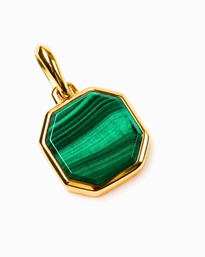 Octagonal green malachite pendant with gold setting and bail, close-up