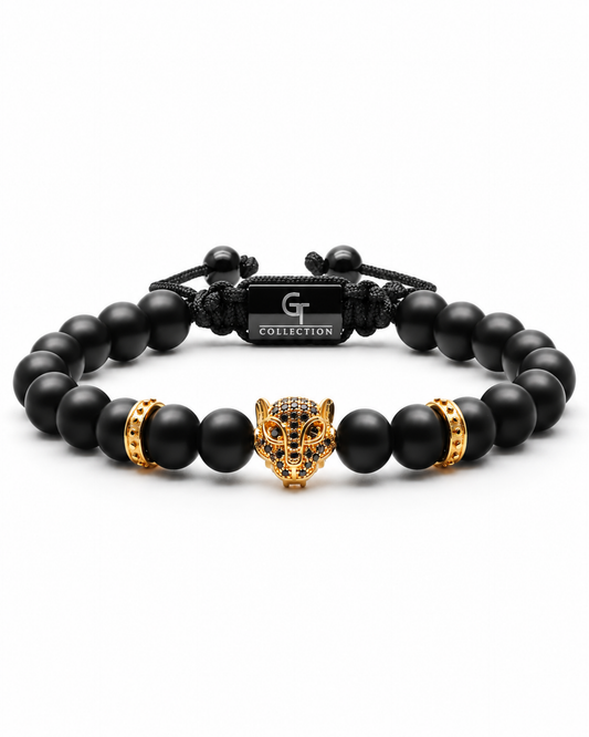 Black bead bracelet with gold leopard head centerpiece and gold barrel spacers