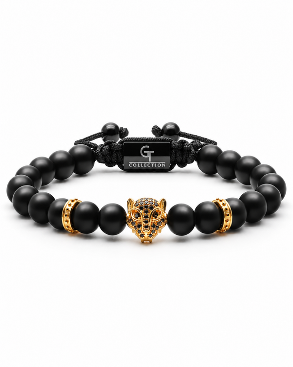Black bead bracelet with gold leopard head centerpiece and gold barrel spacers