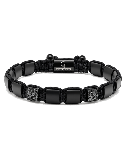 Black bead bracelet with braided rope, square links, and engraved "G COLLECTION" plate