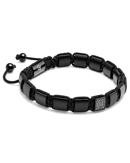 Black beaded bracelet with braided cord, square bead segments, and engraved plate detail