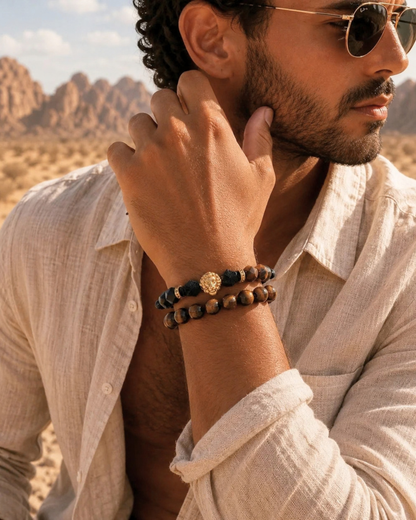 Wrist bracelets: tiger-eye bead strand and black beaded strand with gold charm