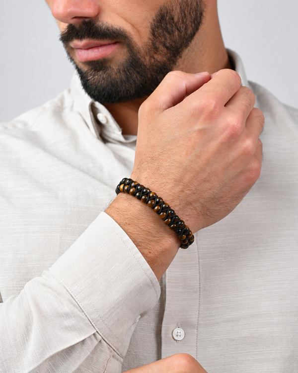 Tiger eye bead double-row bracelet with black bead texture on wrist
