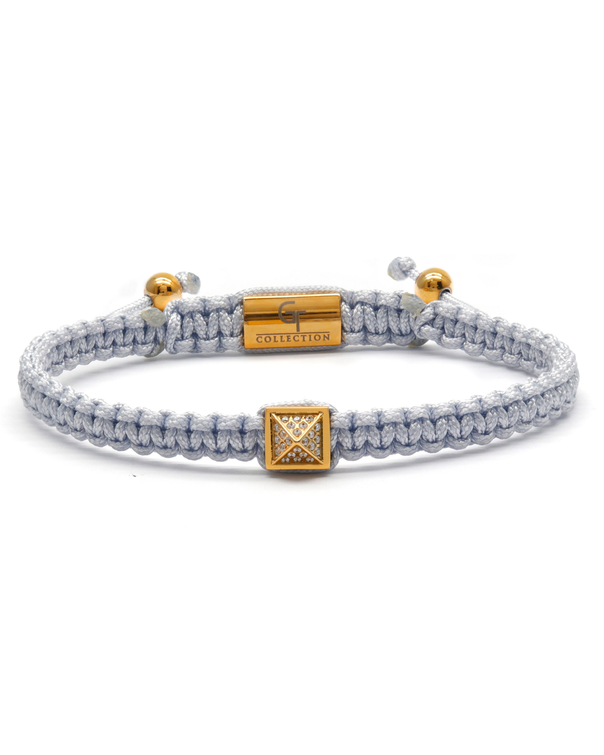 Gold pyramid charm zircon bracelet with light gray braided cord and gold clasp Imagen principal del producto